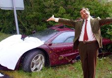 Mr. Bean in front of his Mclaren F1 after a bad accident 